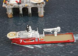 A 1/1250 scale metal model of Skandi Seven, an off-shore support and construction ship. The ship is registered in the Isle of Man and its 250 ton crane can operate in depths of 3000m.
